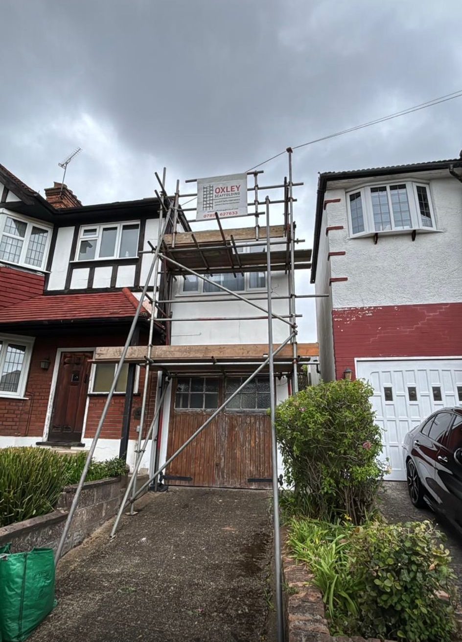 Semi-detached front scaffold with Oxley banner