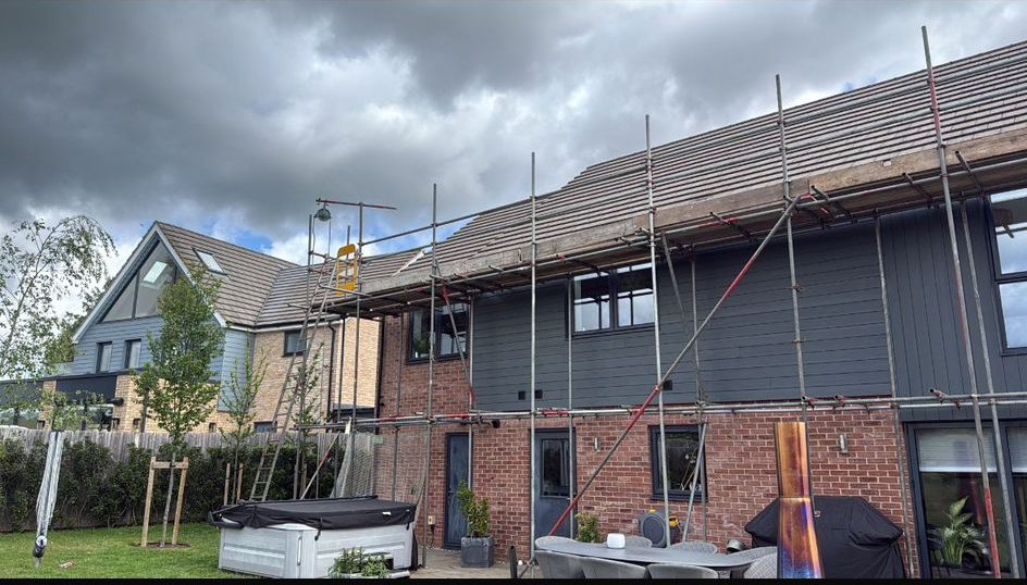 Full-width rear scaffold on a large house