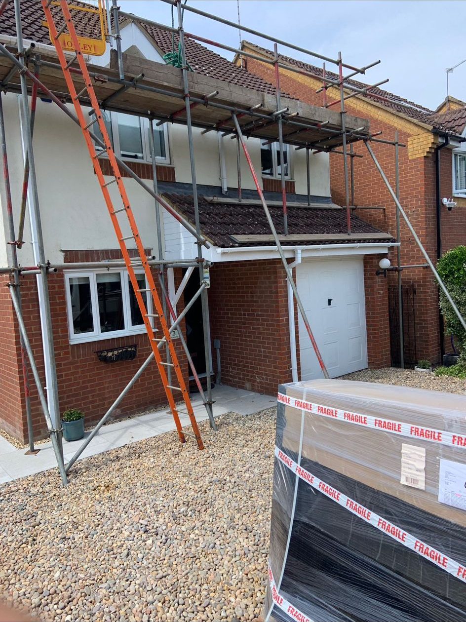 Semi-detached scaffold with ladder access